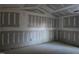 Large bedroom with sloped ceiling and drywall at 105 Forest Dr, Graham, NC 27253