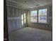 Unfinished bedroom with large windows and drywall at 105 Forest Dr, Graham, NC 27253