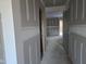 Unfinished hallway with doors to other rooms at 105 Forest Dr, Graham, NC 27253