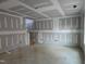 Unfinished living area with staircase at 105 Forest Dr, Graham, NC 27253
