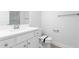 Modern bathroom with white vanity, quartz countertop and shower at 1099 Talisker Way, Burlington, NC 27215