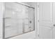 Clean bathroom with a shower/tub combo and sliding glass door at 1099 Talisker Way, Burlington, NC 27215