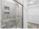 Bathroom with a tiled shower and glass enclosure at 1099 Talisker Way, Burlington, NC 27215