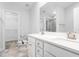Double vanity bathroom with white cabinets and a large mirror at 1099 Talisker Way, Burlington, NC 27215