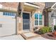 Inviting front entrance with dark-stained door and brick facade at 1099 Talisker Way, Burlington, NC 27215