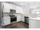 Modern kitchen featuring stainless steel appliances and white shaker cabinets at 1099 Talisker Way, Burlington, NC 27215