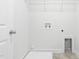Bright laundry room with utility hookups and shelving at 1099 Talisker Way, Burlington, NC 27215