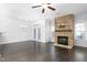 Living room features a stone fireplace and dark hardwood floors at 1099 Talisker Way, Burlington, NC 27215