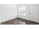 Bright office with wainscoting, hardwood floors, and a window with blinds at 1099 Talisker Way, Burlington, NC 27215