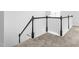 Modern staircase with dark wood railing and white spindles at 1099 Talisker Way, Burlington, NC 27215