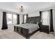 Main bedroom with a king-size bed and dark wood furniture at 151 Potomac River St St, Garner, NC 27529