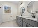 Modern bathroom with double vanity and large mirrors at 1523 Alta Vista Ln, Graham, NC 27253