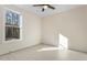 Spacious bedroom with light wood flooring and a ceiling fan at 1523 Alta Vista Ln, Graham, NC 27253