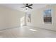 Bright bedroom with hardwood floors and ceiling fan at 1523 Alta Vista Ln, Graham, NC 27253