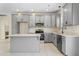 Gray kitchen with white countertops and stainless steel appliances at 1523 Alta Vista Ln, Graham, NC 27253