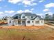 Large two-story house under construction, on a lot with dirt at 1608 Legacy Ridge Ln, Wake Forest, NC 27587