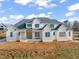 New construction home with white siding and gray roof at 1608 Legacy Ridge Ln, Wake Forest, NC 27587