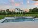 Backyard with a modern pool and lush lawn, ideal for relaxing and enjoying outdoor activities at 1608 Legacy Ridge Ln, Wake Forest, NC 27587