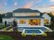 Beautiful backyard featuring a pool with an attached spa, spacious patio, and manicured landscaping at 1608 Legacy Ridge Ln, Wake Forest, NC 27587