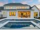 Stunning backyard with a modern pool, covered patio, and an outdoor kitchen perfect for entertaining at 1608 Legacy Ridge Ln, Wake Forest, NC 27587