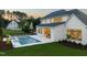 Spacious backyard with a pool, hot tub, and covered patio perfect for outdoor entertaining and relaxation at 1608 Legacy Ridge Ln, Wake Forest, NC 27587