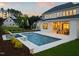Backyard featuring a pool and hot tub, enhanced by landscaping, creating a serene outdoor space at 1608 Legacy Ridge Ln, Wake Forest, NC 27587