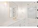 Bright bathroom with gold hardware, a large mirror, white marble countertops, and white shaker cabinets at 1608 Legacy Ridge Ln, Wake Forest, NC 27587