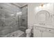 Modern bathroom with a marble tiled shower, hexagonal floor tiles, and white vanity at 1608 Legacy Ridge Ln, Wake Forest, NC 27587
