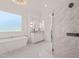 Luxurious bathroom featuring a soaking tub, a spacious shower, and elegant white marble finishes at 1608 Legacy Ridge Ln, Wake Forest, NC 27587