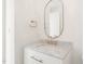 Clean bathroom with marble countertop, white vanity, gold hardware, and modern fixtures at 1608 Legacy Ridge Ln, Wake Forest, NC 27587