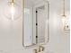 Well-lit bathroom with gold fixtures, pendant lighting, and a mirror reflecting a clean, modern design at 1608 Legacy Ridge Ln, Wake Forest, NC 27587