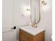 Modern bathroom boasts stylish vanity with gold accents, sleek fixtures, and elegant lighting at 1608 Legacy Ridge Ln, Wake Forest, NC 27587
