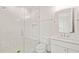 Modern bathroom featuring a glass shower, white vanity, and white marbled walls at 1608 Legacy Ridge Ln, Wake Forest, NC 27587
