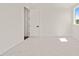 Bright bedroom featuring neutral carpet, white walls, and base trim at 1608 Legacy Ridge Ln, Wake Forest, NC 27587