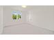 Bright bedroom with white walls, plush carpeting, and natural light from the large window at 1608 Legacy Ridge Ln, Wake Forest, NC 27587