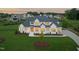 An impressive, modern farmhouse-style home with manicured lawn and elegant landscaping at dusk at 1608 Legacy Ridge Ln, Wake Forest, NC 27587