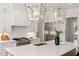 Well-equipped kitchen with a marble island, stainless steel range, and custom cabinetry for a sleek, modern look at 1608 Legacy Ridge Ln, Wake Forest, NC 27587
