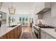 Bright, open kitchen featuring a large island, high-end appliances, and seamless transition to the dining area at 1608 Legacy Ridge Ln, Wake Forest, NC 27587