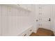 Convenient mudroom with built-in bench seating, hooks, storage cabinets, and entry to the home at 1608 Legacy Ridge Ln, Wake Forest, NC 27587