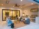 Inviting outdoor living area with comfortable seating, an outdoor kitchen, and a cozy ambiance at 1608 Legacy Ridge Ln, Wake Forest, NC 27587