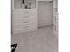 Charming walk-in closet with gray carpet and built in shelving and drawers with silver pulls at 1608 Legacy Ridge Ln, Wake Forest, NC 27587