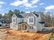 New construction home; gray siding, large windows, and a spacious backyard at 1609 Legacy Ridge Ln, Wake Forest, NC 27587