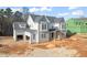 Two-story house under construction with gray siding, attached garage, and landscaping at 1609 Legacy Ridge Ln, Wake Forest, NC 27587