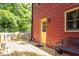Spacious back porch area, featuring a wood deck and a view of the tree lined backyard at 211 Dwelling Pl, Knightdale, NC 27545