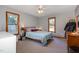 Bedroom with a double bed, dresser, and two windows at 211 Dwelling Pl, Knightdale, NC 27545