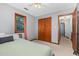 Bedroom with a cozy atmosphere, plush carpet, window, and access to another room enhancing versatility at 211 Dwelling Pl, Knightdale, NC 27545