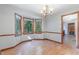 Bright dining room featuring hardwood floors, a chandelier, and a charming bay window at 211 Dwelling Pl, Knightdale, NC 27545