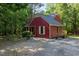 Exterior side view showing a compact home with a well-maintained yard and a newly added deck at 211 Dwelling Pl, Knightdale, NC 27545