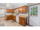Bright kitchen with wooden cabinets and access to the backyard at 211 Dwelling Pl, Knightdale, NC 27545