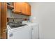 Laundry room featuring a modern, front-loading washer and dryer at 211 Dwelling Pl, Knightdale, NC 27545